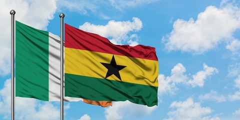 Ireland and Ghana flag waving in the wind against white cloudy blue sky together. Diplomacy concept, international relations.