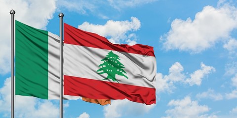 Ireland and Lebanon flag waving in the wind against white cloudy blue sky together. Diplomacy concept, international relations.