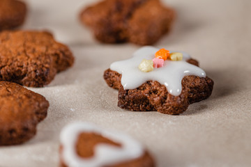 Christmas festive homemade gingerbread cookies decorated with confectionery glaze. Close-up.