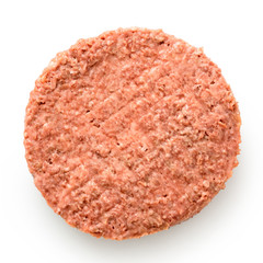 Uncooked plant based vegetarian burger patty isolated on white. Top view.