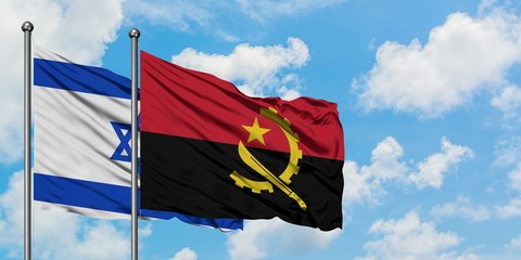 Israel and Angola flag waving in the wind against white cloudy blue sky together. Diplomacy concept, international relations.