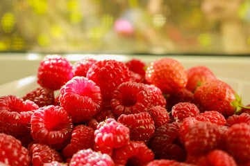 fresh raspberries on wooden background