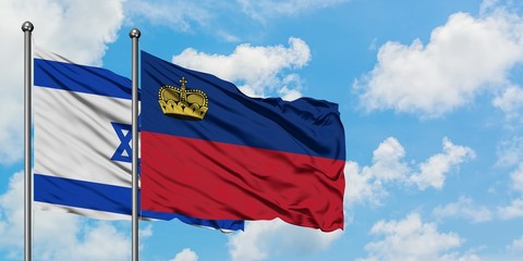 Israel and Liechtenstein flag waving in the wind against white cloudy blue sky together. Diplomacy concept, international relations.