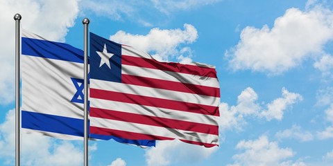 Israel and Liberia flag waving in the wind against white cloudy blue sky together. Diplomacy concept, international relations.