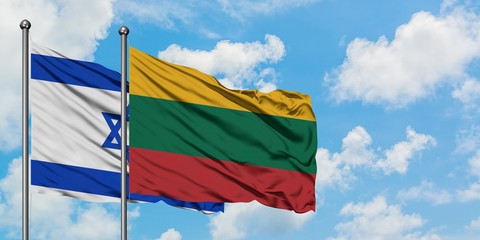 Israel and Lithuania flag waving in the wind against white cloudy blue sky together. Diplomacy concept, international relations.