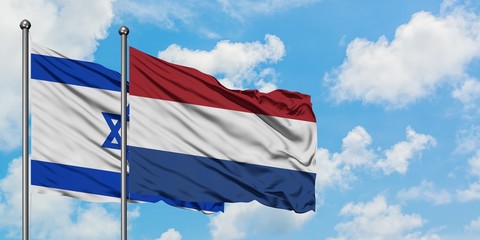 Israel and Netherlands flag waving in the wind against white cloudy blue sky together. Diplomacy concept, international relations.