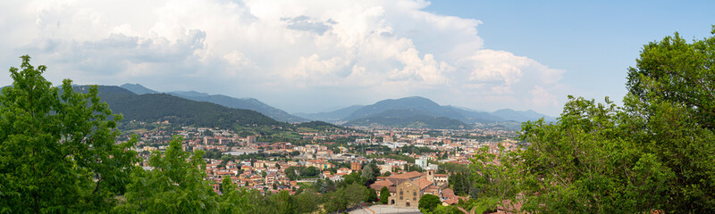 Fototapeta na wymiar Beautiful buildings on the hills. Bergamo. Beautiful, panoramic view. Journey to Italy. Green Summer Landscape. 