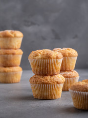 Tasty breakfast lemon and vanilla muffins on gray background, minimalism