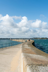 the long and winding stone harbor jetty in Saint-Malo