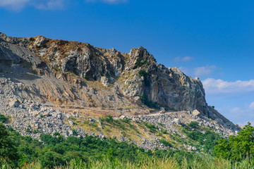 Fototapeta na wymiar Top of rock mountain.High mountain cliffs with blue sky in Thailand.