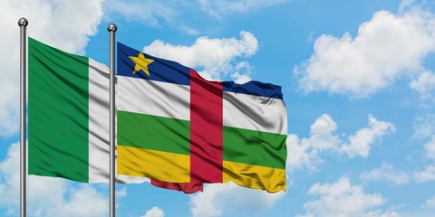 Italy and Central African Republic flag waving in the wind against white cloudy blue sky together. Diplomacy concept, international relations.