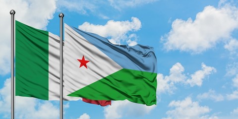 Italy and Djibouti flag waving in the wind against white cloudy blue sky together. Diplomacy concept, international relations.