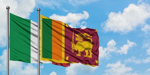 Italy and Sri Lanka flag waving in the wind against white cloudy blue sky together. Diplomacy concept, international relations.