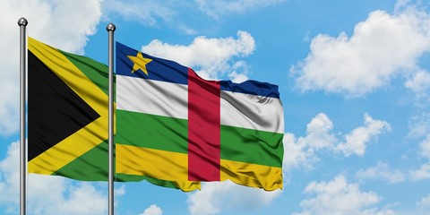 Jamaica and Central African Republic flag waving in the wind against white cloudy blue sky together. Diplomacy concept, international relations.