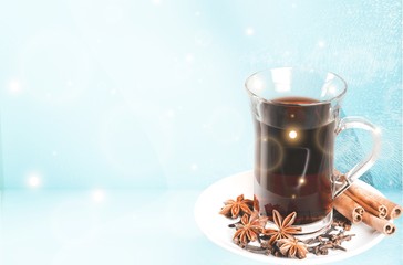 Red wine pouring in glass on  background