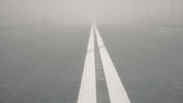 Road marking. Close-up. Asphalt road for traffic. Road construction. Background