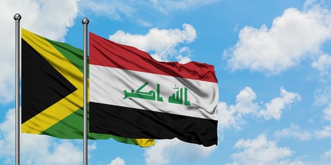 Jamaica and Iraq flag waving in the wind against white cloudy blue sky together. Diplomacy concept, international relations.