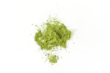 Wooden spoon with powdered matcha green tea in bowl isolated on white background.