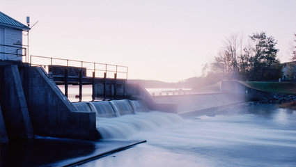 A Small Dam lets Runoff Go from a Lake - obrazy, fototapety, plakaty