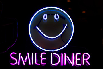 smilie face in neon