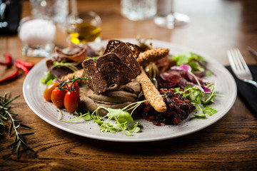Meat platter for two served on a plate in restaurant