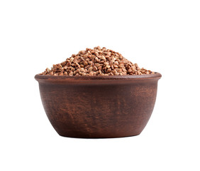 buckwheat in a clay cup isolated on white background