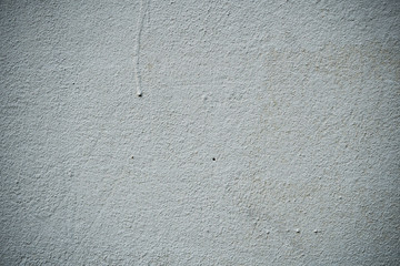 Texture of an old wall covered with paint. Background image of a worn paint coated surface