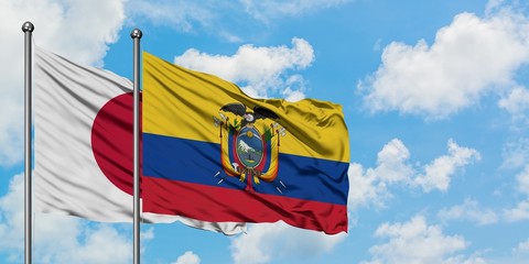 Japan and Ecuador flag waving in the wind against white cloudy blue sky together. Diplomacy concept, international relations.
