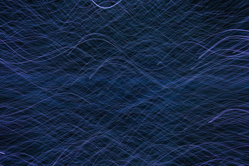 The abstract pattern made by the blue LED lights while moving with the camera. 
