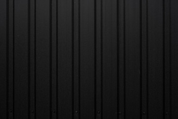 Black Corrugated metal sheet texture surface of the wall. Galvanize steel background.