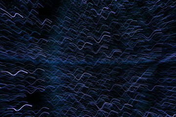 The abstract pattern made by the blue LED lights while moving with the camera. 