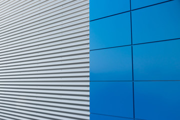 Geometric colored building facade elements with planes, lines and corners with light flare and...