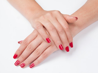 Fototapeta premium Woman's hands with red manicure