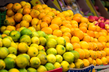 Fresh limes and oranges at the fruit and vegetable market