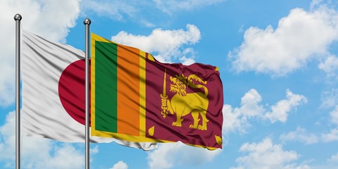Japan and Sri Lanka flag waving in the wind against white cloudy blue sky together. Diplomacy concept, international relations.