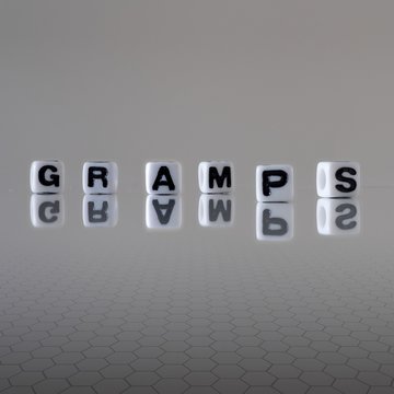 The concept of gramps represented by black and white plastic letter cubes