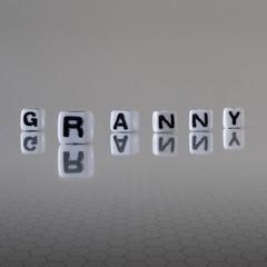 The concept of granny represented by black and white plastic letter cubes