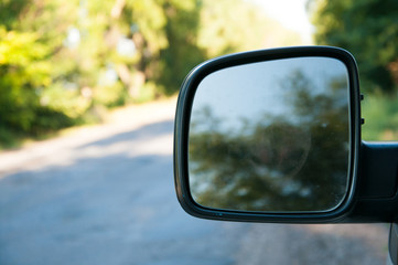 Car rear view mirror. Close-up. Reflection in the mirror.