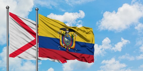 Jersey and Ecuador flag waving in the wind against white cloudy blue sky together. Diplomacy concept, international relations.