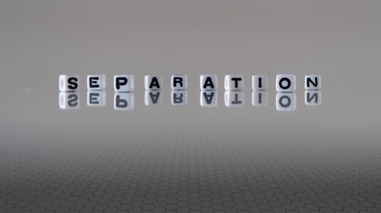 The concept of separation represented by wooden letter tiles