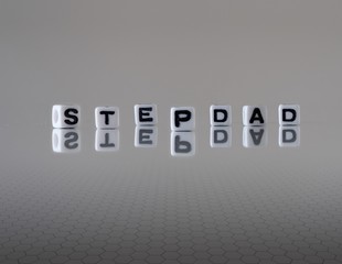 The concept of stepdad represented by wooden letter tiles