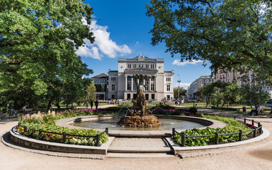 Fototapeta na wymiar Nymph fountain and National Opera in Riga; Latvia