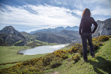 Fototapeta premium A young woman looking at the lakes of Covadonga, Asturias. Spain
