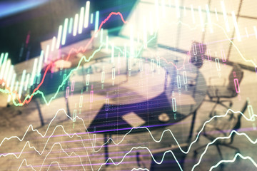Double exposure of forex chart on conference room background. Concept of stock market analysis