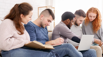Fototapeta premium Group of diverse students preparing for classes