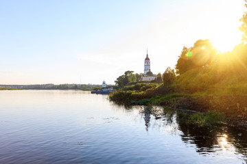 Russian Church of the Resurrection against the blue sky, Totma, Russia. Sunset on the banks of the Sukhona river in the city of Totma