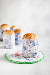 Homemade Easter cakes in paper wrapper. Light background