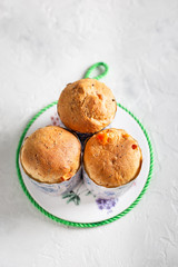 Homemade Easter cakes in paper wrapper. Light background