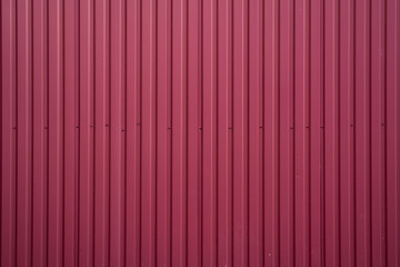 Red Corrugated metal sheet texture surface of the wall. Galvanize steel background.