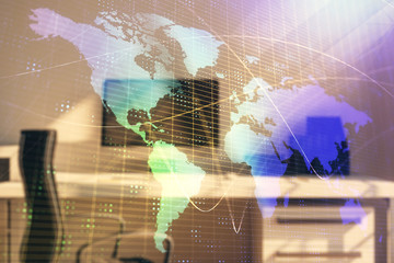 Map hologram and desktop office computer background. Multi exposure. Concept of international business